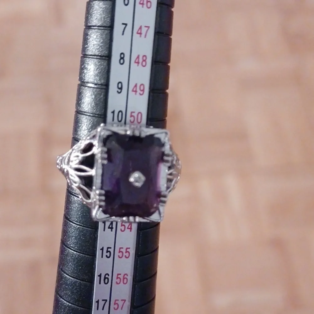 Silver ring marked s925 size 6 purple  stone
